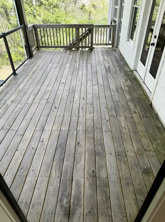 Illustration of the deck before: weathered, unsealed grey boards