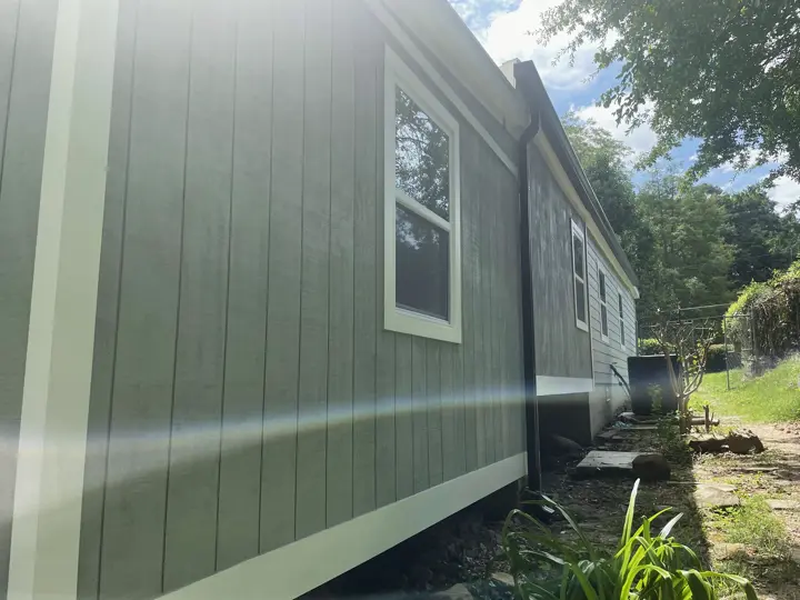 Repaired and repainted panel siding